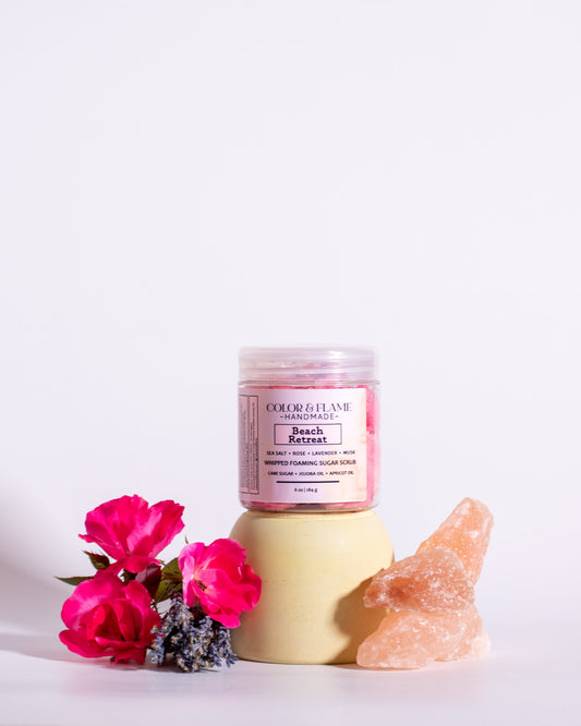 Color & Flame Handmade Beach Retreat whipped foaming sugar scrub styled with pink roses, lavender, and pink salt crystals.
