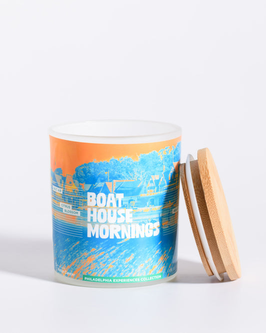 Color & Flame Handmade Boat House Mornings Philadelphia Experiences candle shown open with its bamboo lid beside the jar.