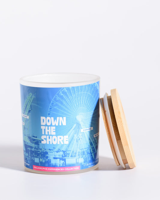 Color & Flame Handmade Down the Shore Philadelphia Experiences candle shown open with its bamboo lid beside the jar.