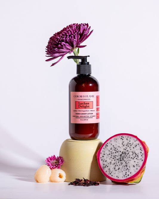 Color & Flame Handmade Lychee Delight hand and body lotion styled with dragon fruit, lychee, dried botanicals, and flowers.