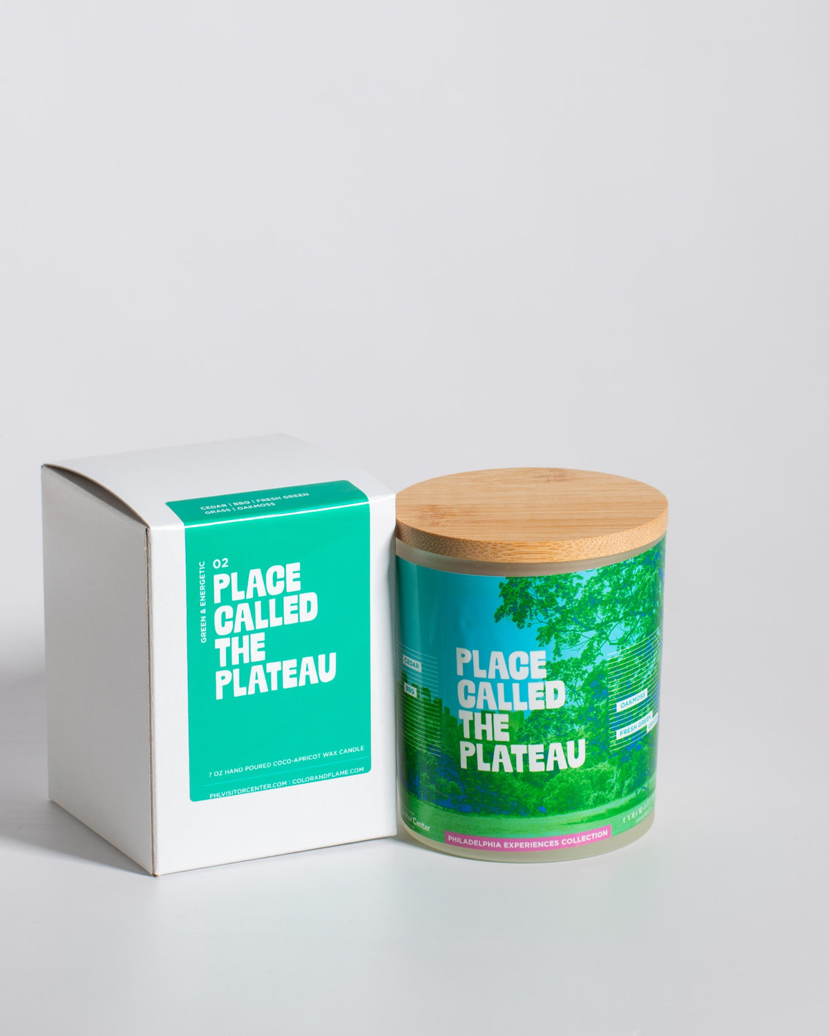 Color & Flame Handmade Place Called the Plateau Philadelphia Experiences candle displayed beside its white box.