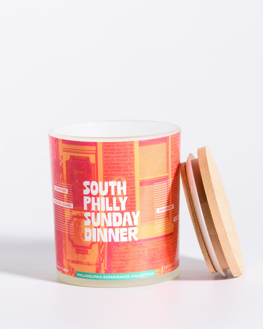 Color & Flame Handmade South Philly Sunday Dinner Philadelphia Experiences candle shown open with its bamboo lid beside the jar.