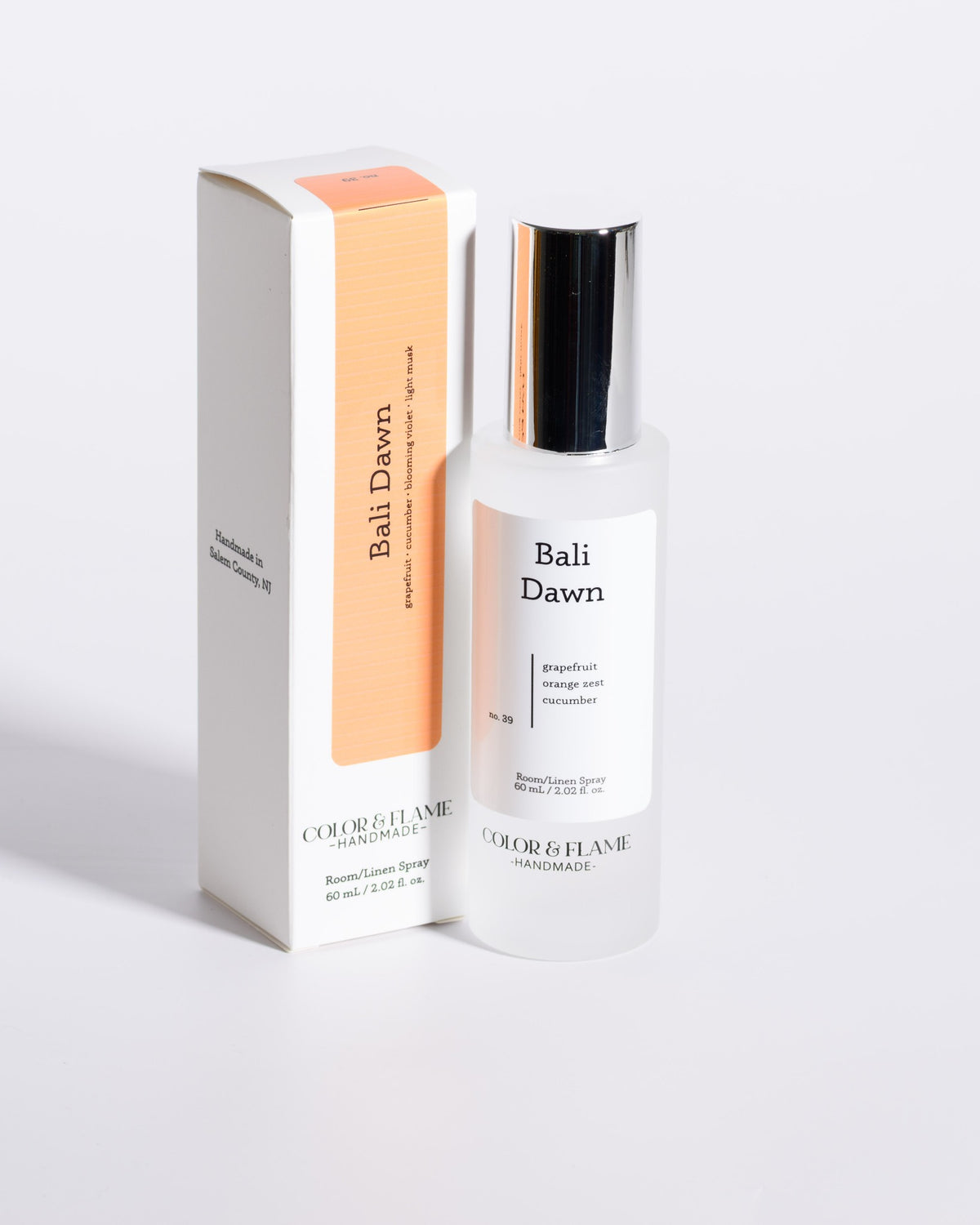 Color & Flame Handmade Bali Dawn room and linen spray displayed beside its white box.
