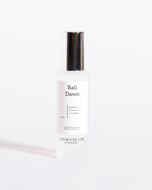 Color & Flame Handmade Bali Dawn room and linen spray bottle with its silver cap attached.
