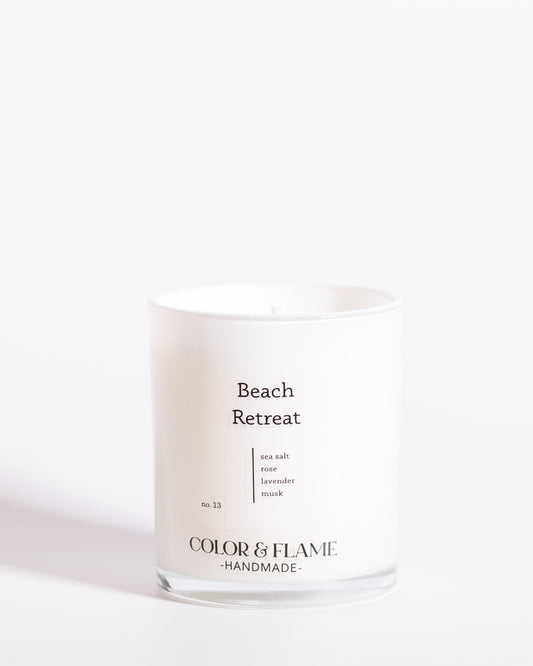 Color & Flame Handmade Beach Retreat Core Collection candle in a white glass jar.
