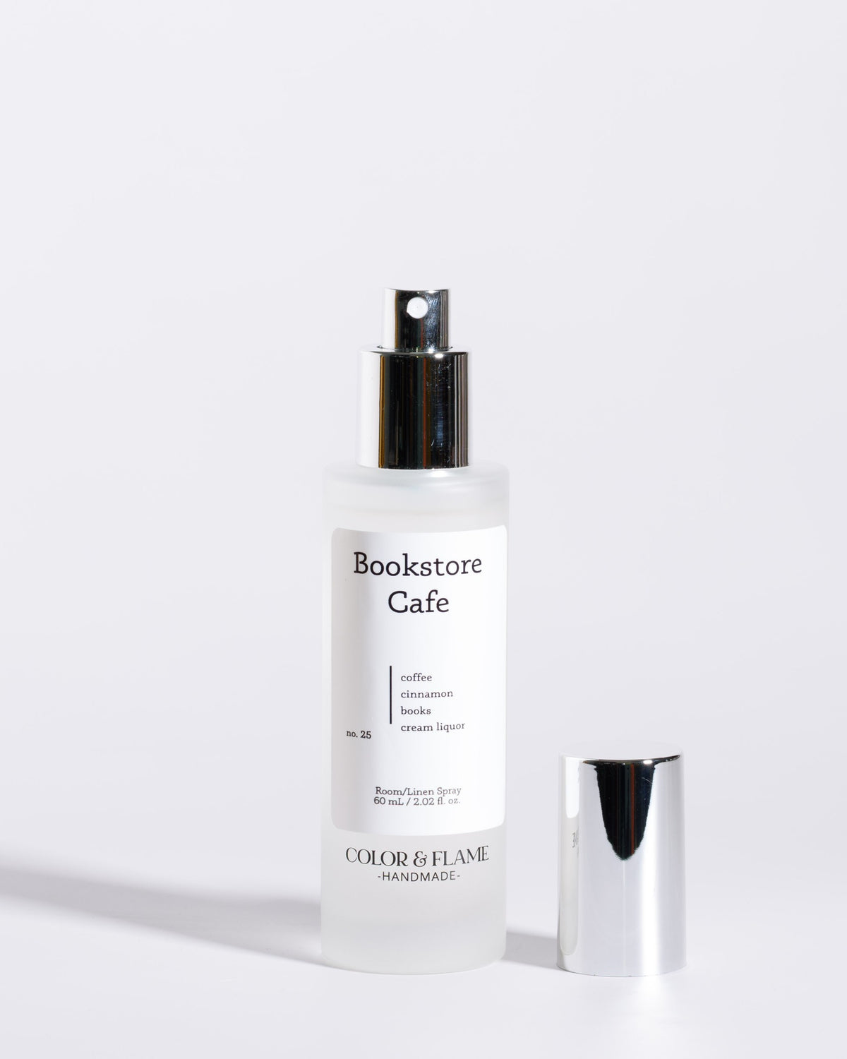 Color & Flame Handmade Bookstore Cafe room and linen spray bottle with cap removed to show the atomizer.
