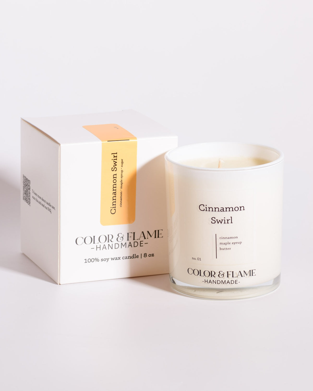 Color & Flame Handmade Cinnamon Swirl Core Collection candle displayed beside its white box.
