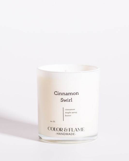 Color & Flame Handmade Cinnamon Swirl Core Collection candle in a white glass jar.
