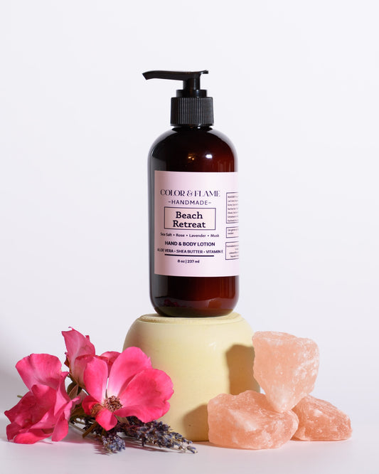 Color & Flame Handmade Beach Retreat hand and body lotion styled with roses, lavender, and pink salt crystals.
