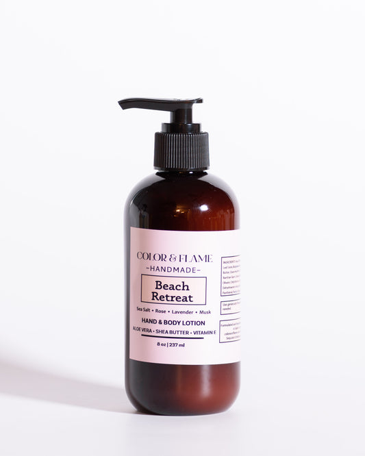 Color & Flame Handmade Beach Retreat hand and body lotion in an amber pump bottle on a white background.
