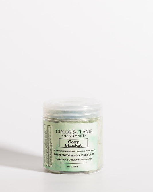 Color & Flame Handmade Cozy Blanket whipped foaming sugar scrub in a clear jar with a green label.
