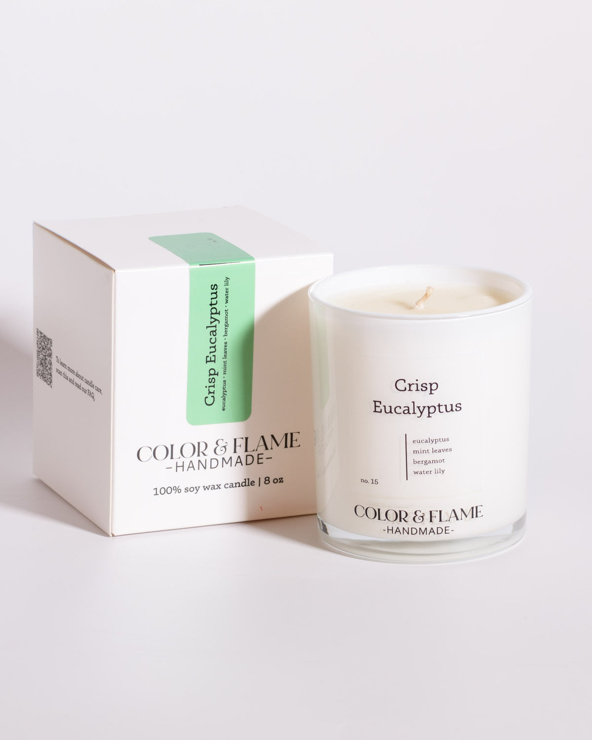 Color & Flame Handmade Crisp Eucalyptus Core Collection candle displayed beside its white box.
