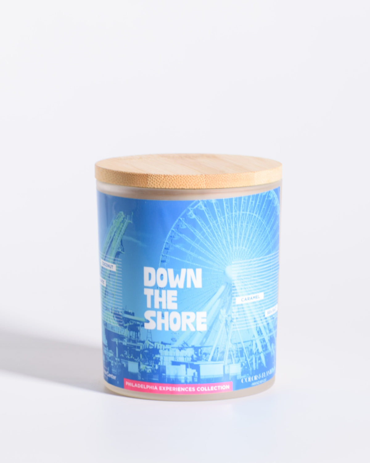 Color & Flame Handmade Down the Shore Philadelphia Experiences candle with its bamboo lid attached.
