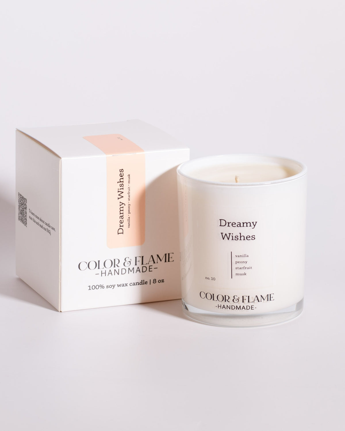 Color & Flame Handmade Dreamy Wishes Core Collection candle displayed beside its white box.
