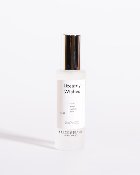 Color & Flame Handmade Dreamy Wishes room and linen spray bottle with its silver cap attached.
