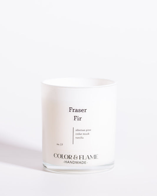 Color & Flame Handmade Fraser Fir Core Collection candle in a white glass jar.

