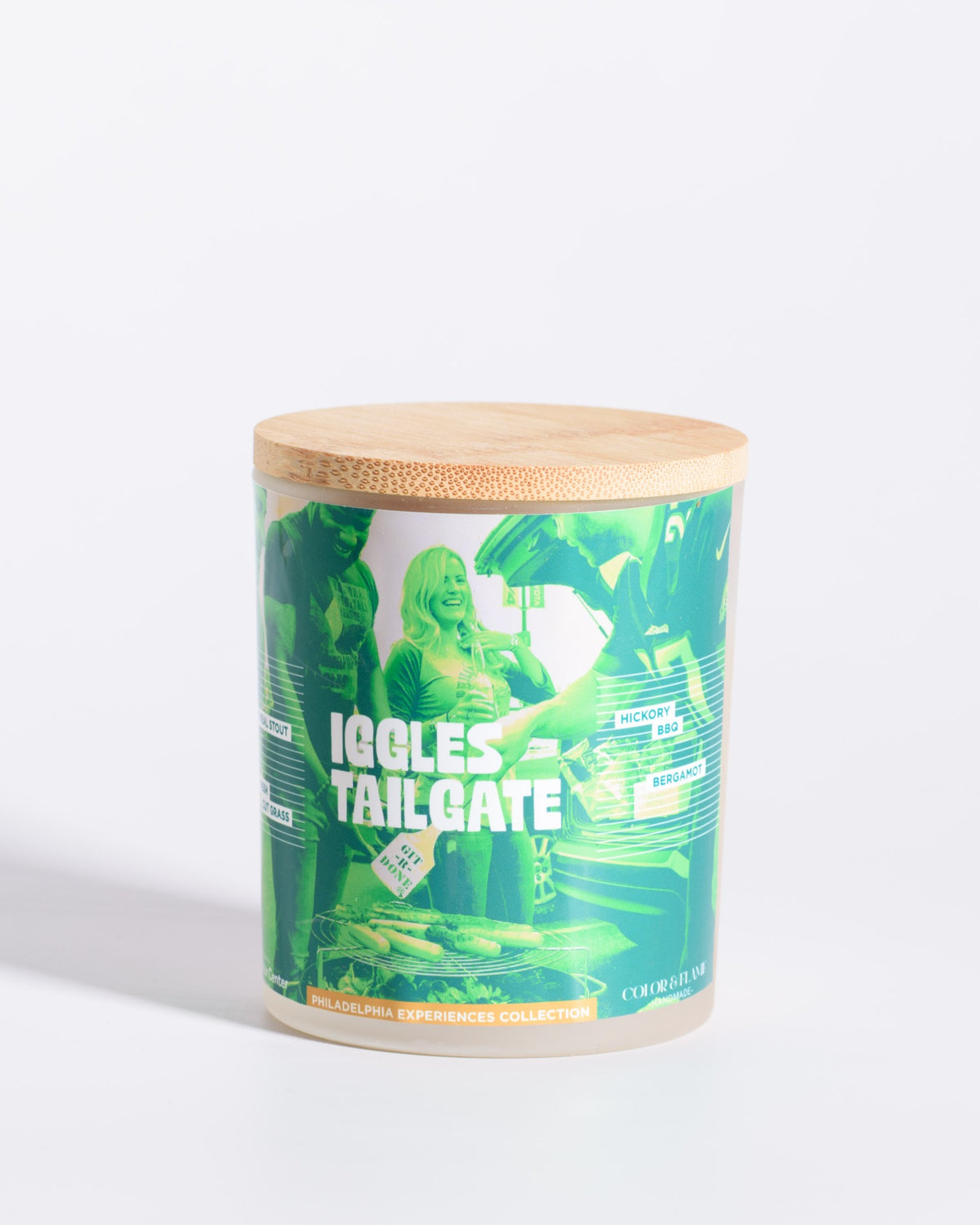 Color & Flame Handmade Iggles Tailgate Philadelphia Experiences candle with its bamboo lid attached.
