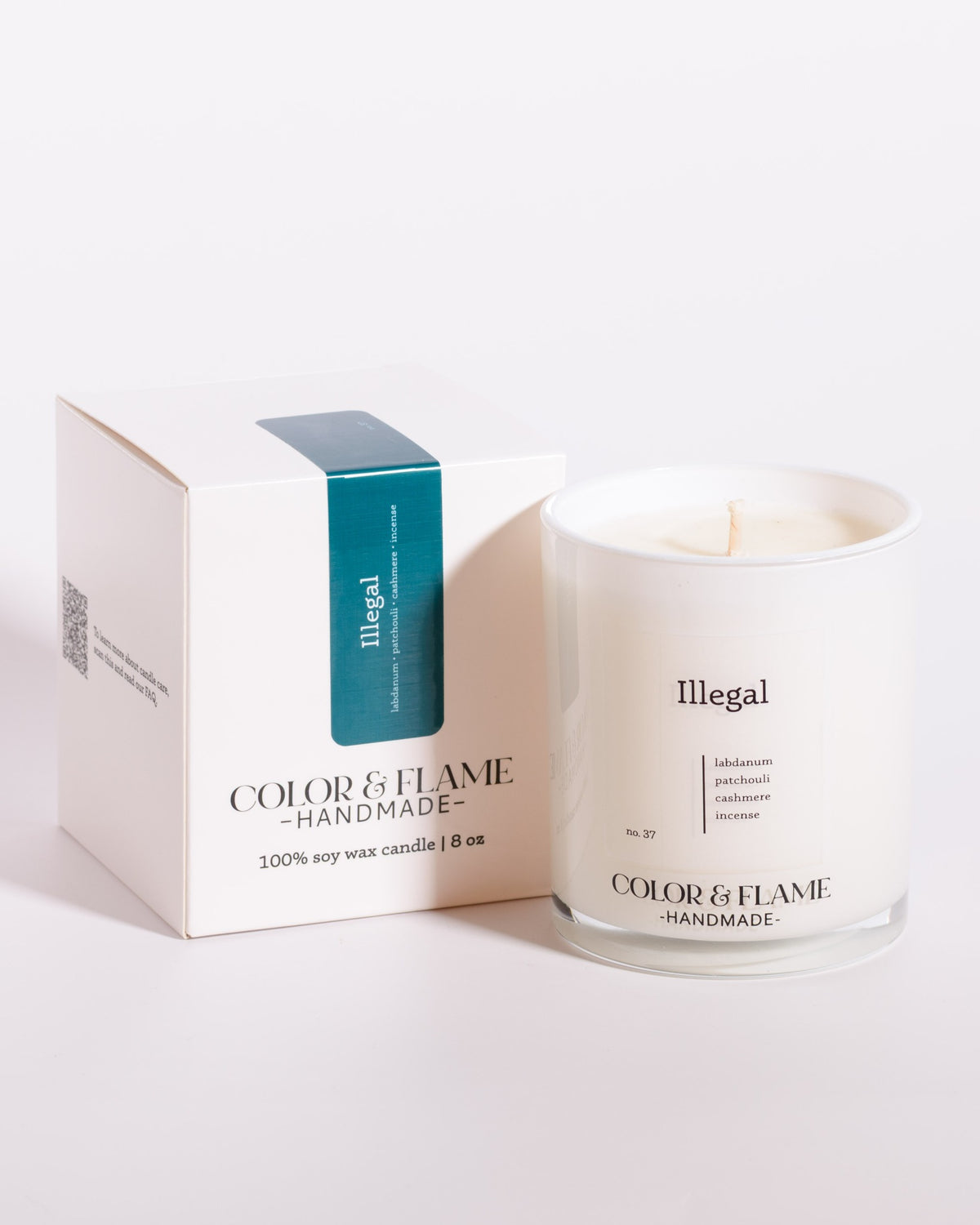 Color & Flame Handmade Illegal Core Collection candle displayed beside its white box.
