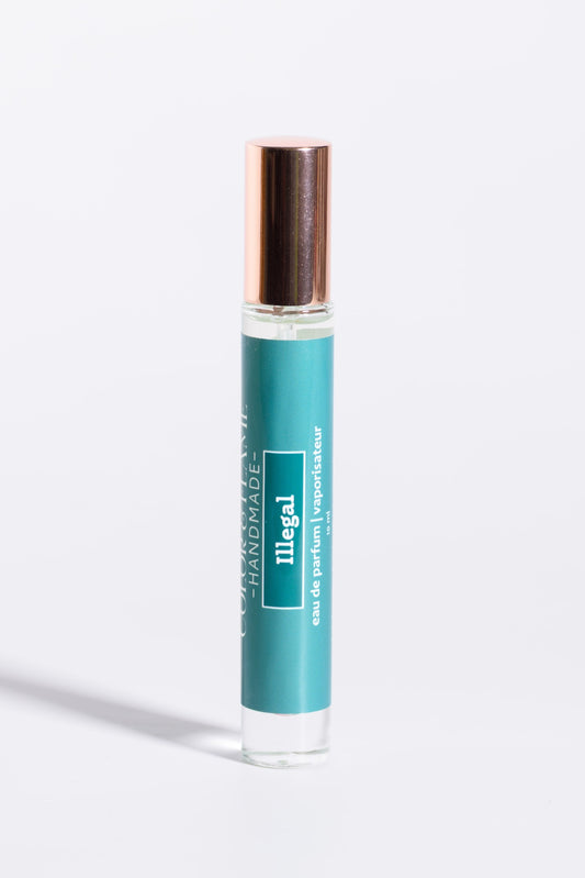 Color & Flame Handmade Illegal 10 ml perfume spray with its rose-gold cap attached.

