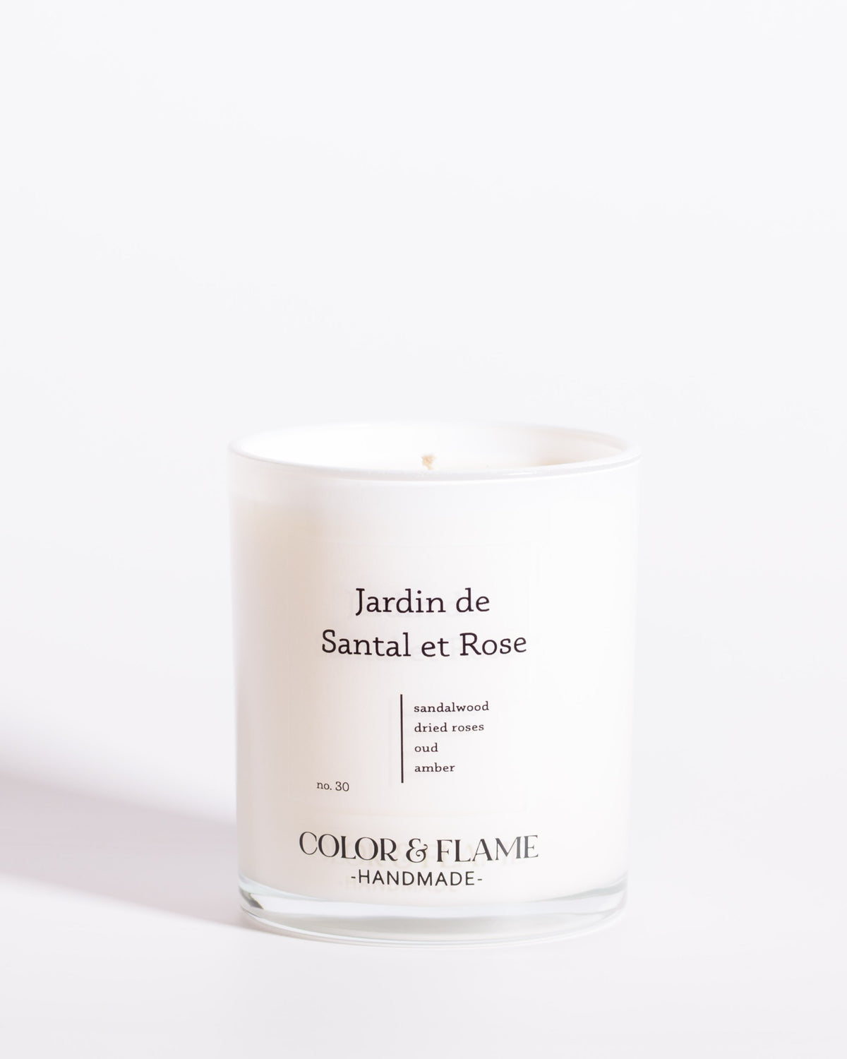 Color & Flame Handmade Jardin de Santal et Rose Core Collection candle in a white glass jar.
