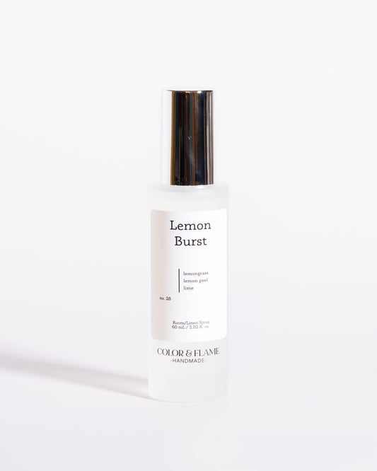 Color & Flame Handmade Lemon Burst room and linen spray bottle with its silver cap attached.
