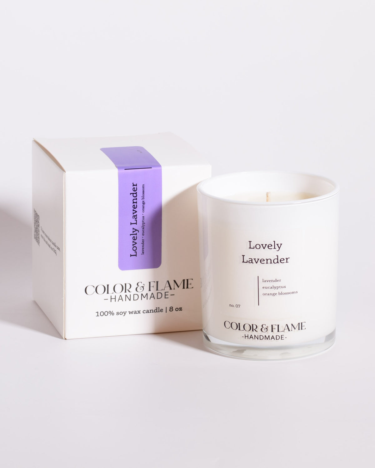 Color & Flame Handmade Lovely Lavender Core Collection candle displayed beside its white box.
