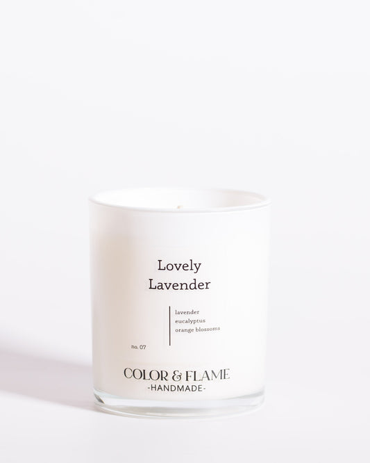 Color & Flame Handmade Lovely Lavender Core Collection candle in a white glass jar.
