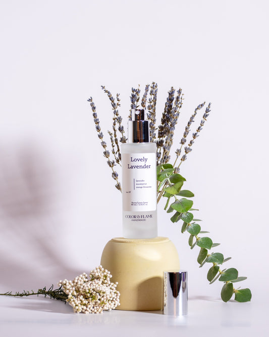 Color & Flame Handmade Lovely Lavender room and linen spray styled with lavender, eucalyptus, and white flowers.
