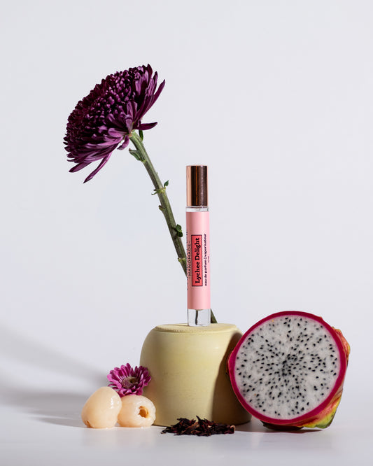 Color & Flame Handmade Lychee Delight perfume spray styled with dragon fruit, lychee, purple and pink flowers, and dried botanicals.
