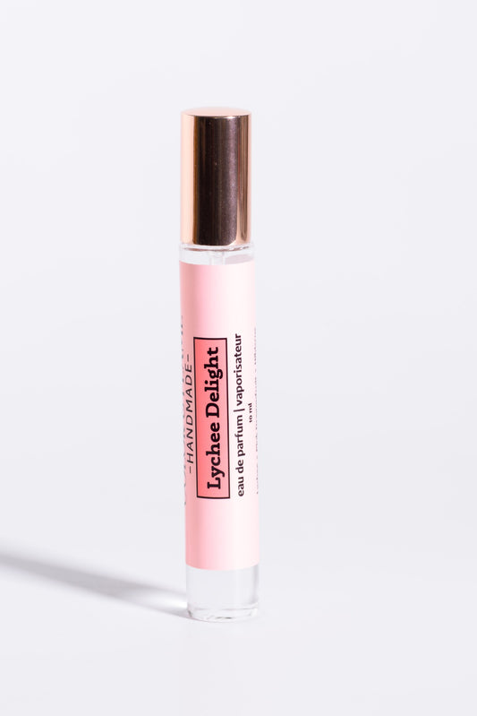 Color & Flame Handmade Lychee Delight 10 ml perfume spray with its rose-gold cap attached.
