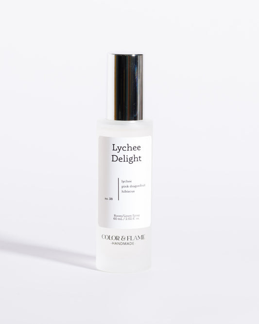 Color & Flame Handmade Lychee Delight room and linen spray bottle with its silver cap attached.
