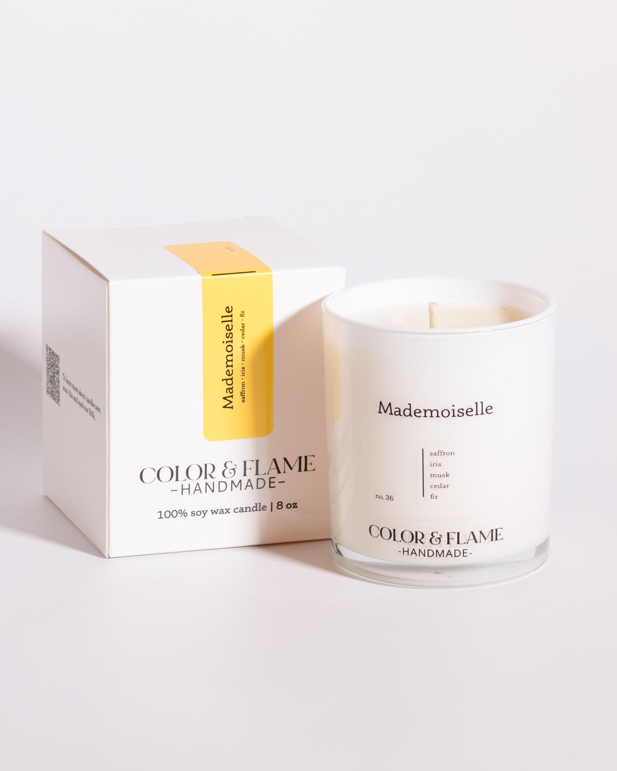 Color & Flame Handmade Mademoiselle Core Collection candle displayed beside its white box.
