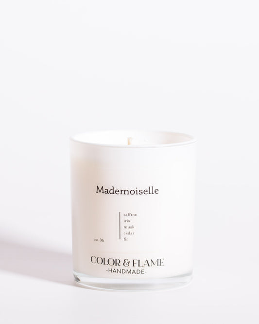 Color & Flame Handmade Mademoiselle Core Collection candle in a white glass jar.
