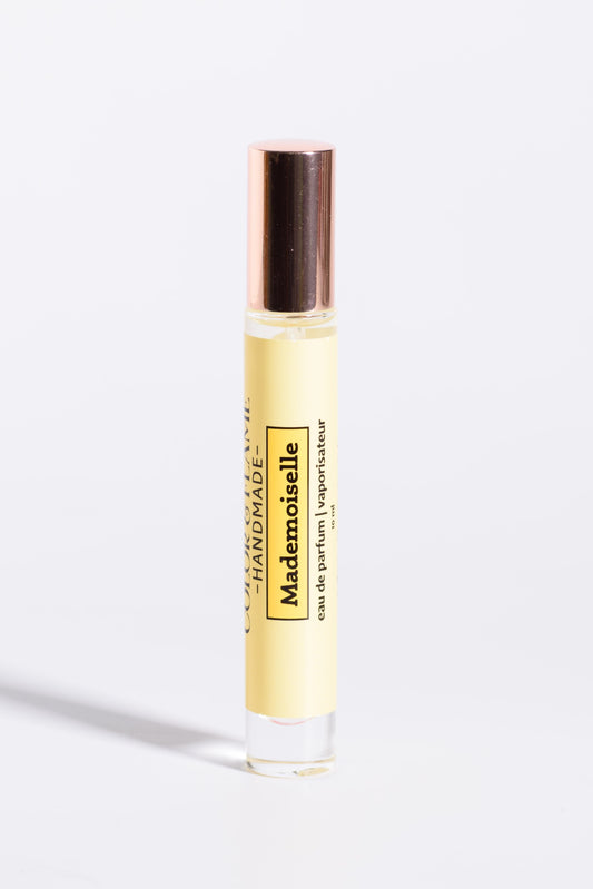 Color & Flame Handmade Mademoiselle 10 ml perfume spray with its rose-gold cap attached.
