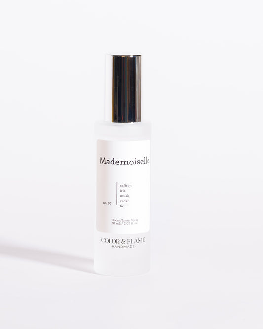 Color & Flame Handmade Mademoiselle room and linen spray bottle with its silver cap attached.
