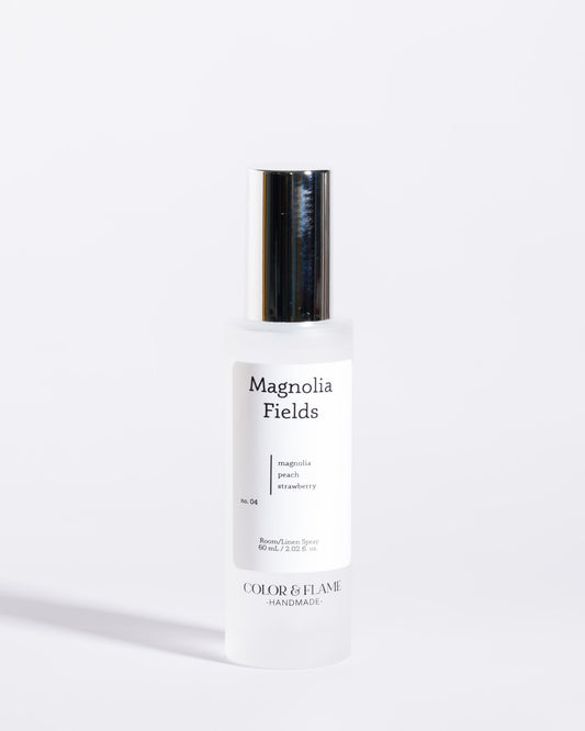 Color & Flame Handmade Magnolia Fields room and linen spray bottle with its silver cap attached.
