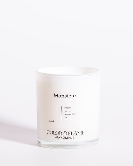 Color & Flame Handmade Monsieur Core Collection candle in a white glass jar.
