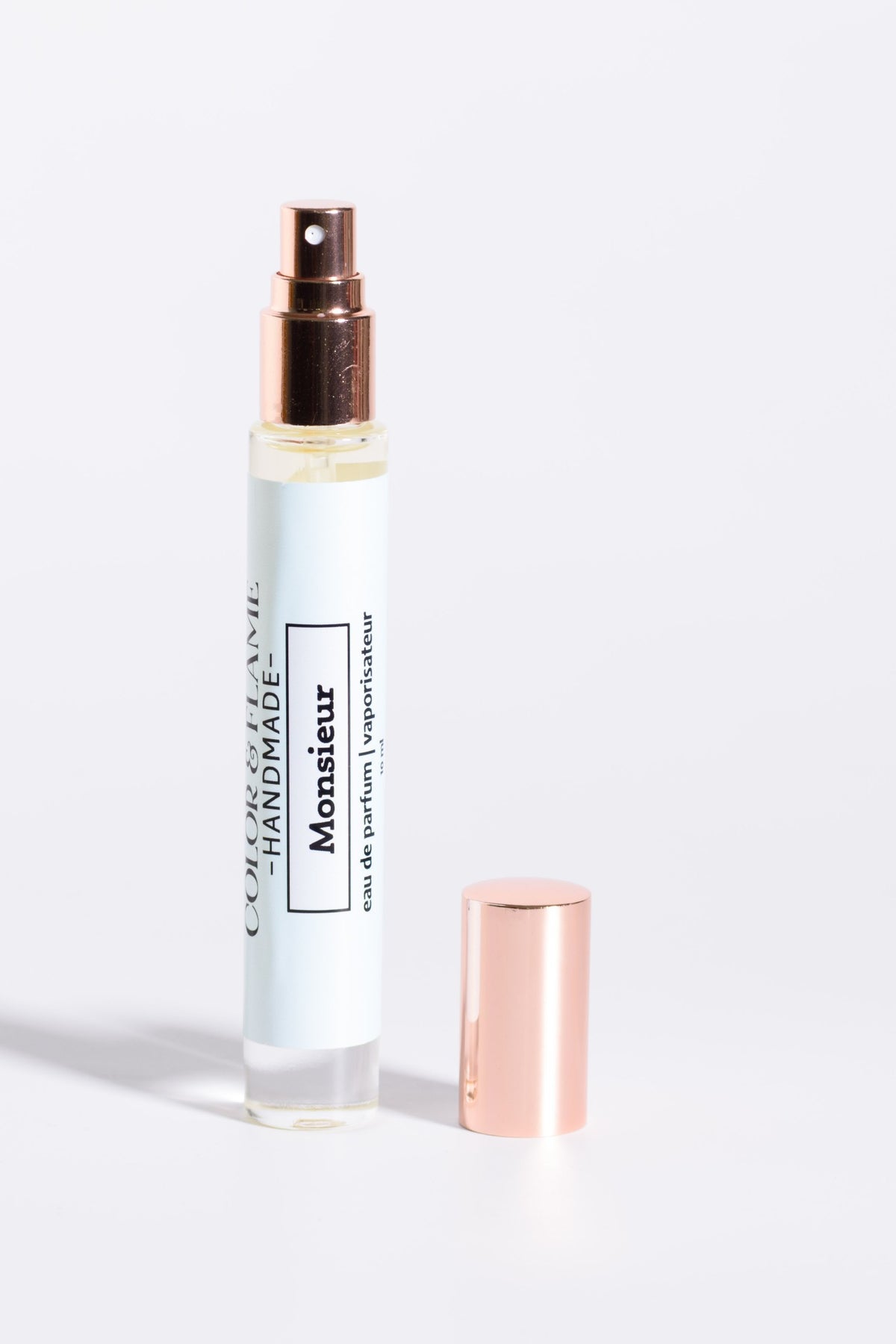 Color & Flame Handmade Monsieur 10 ml perfume spray with cap removed to show the atomizer.
