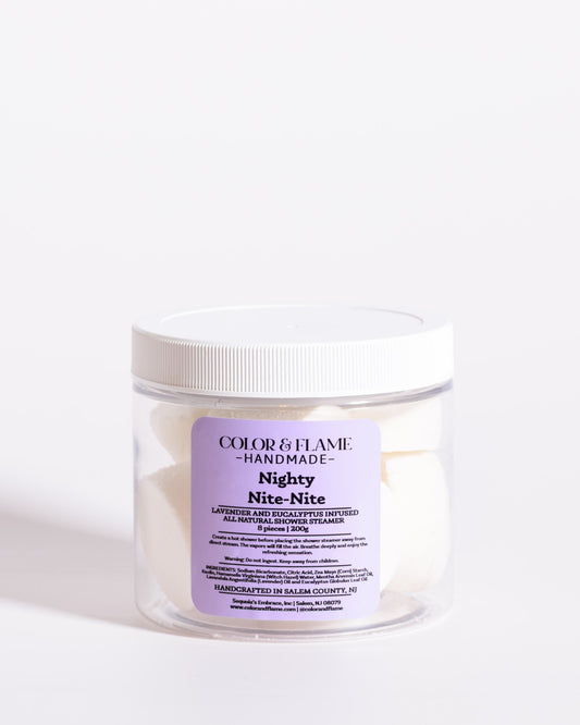Color & Flame Handmade Nighty Nite-Nite lavender and eucalyptus shower steamers in a clear jar.