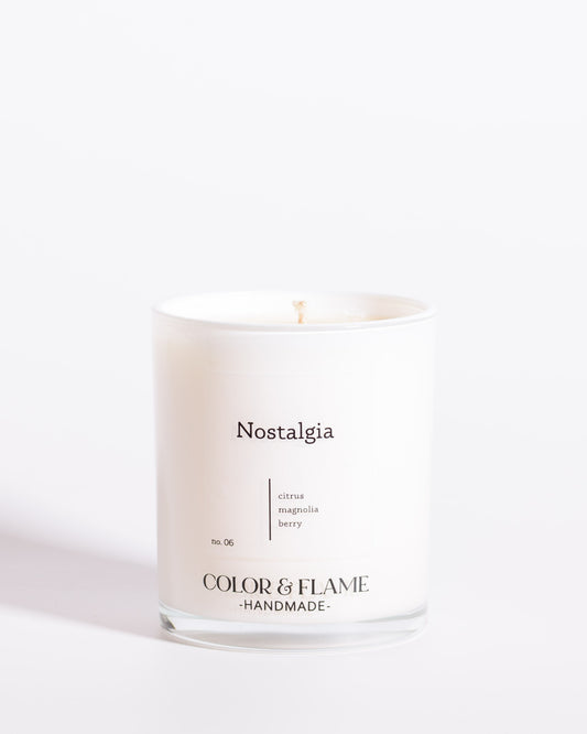 Color & Flame Handmade Nostalgia Core Collection candle in a white glass jar.
