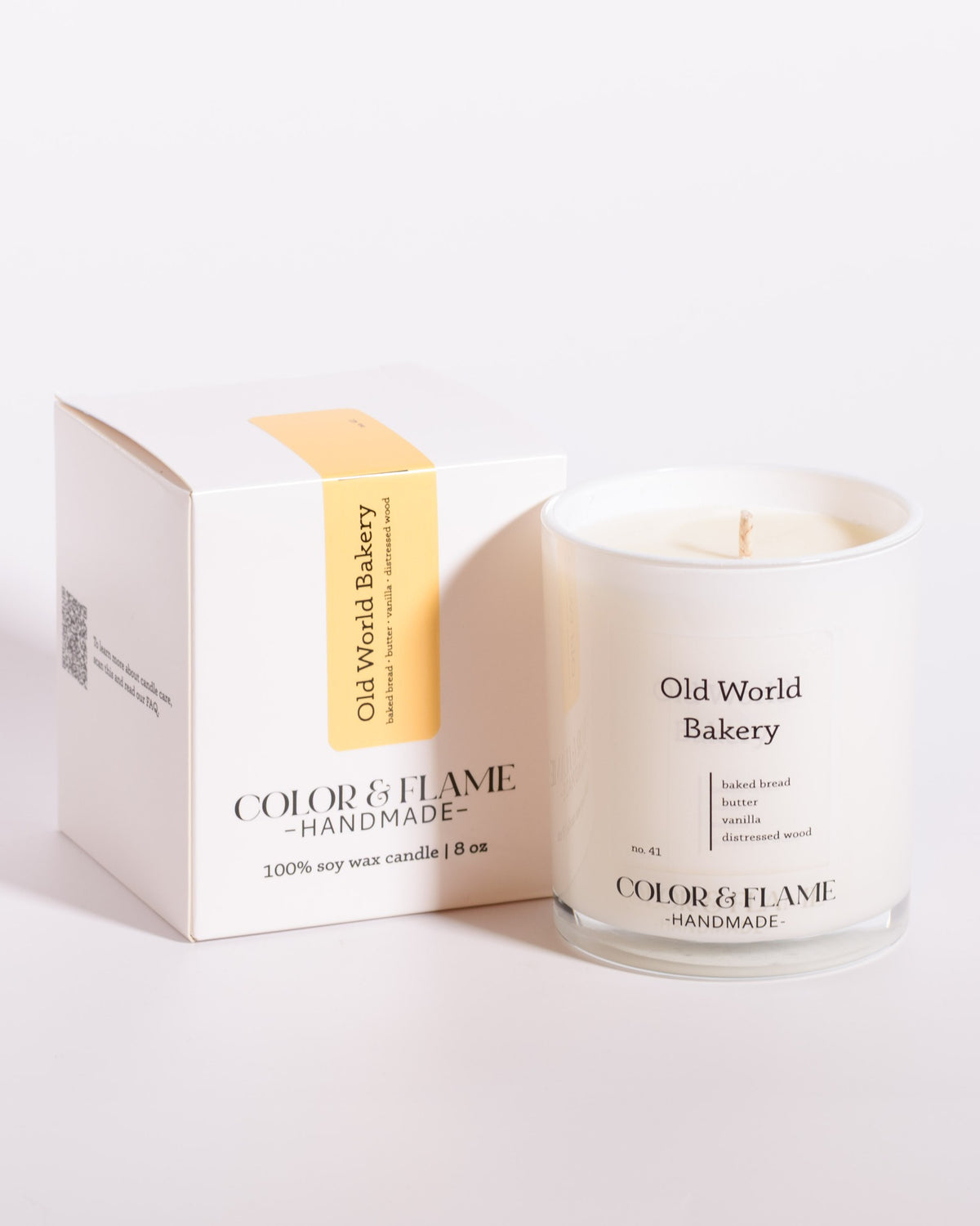 Color & Flame Handmade Old World Bakery Core Collection candle displayed beside its white box.
