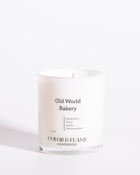 Color & Flame Handmade Old World Bakery Core Collection candle in a white glass jar.
