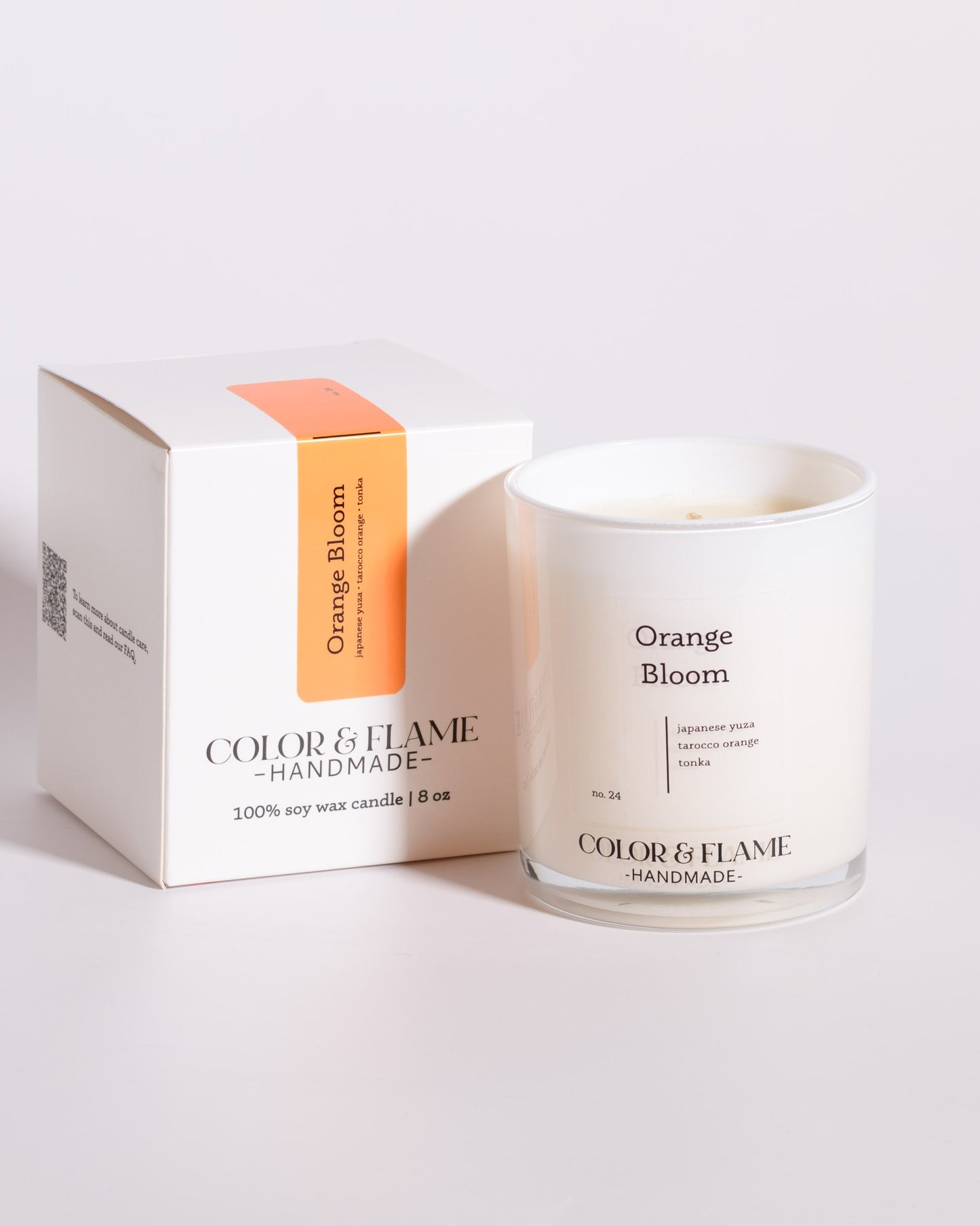 Color & Flame Handmade Orange Bloom Core Collection candle displayed beside its white box.

