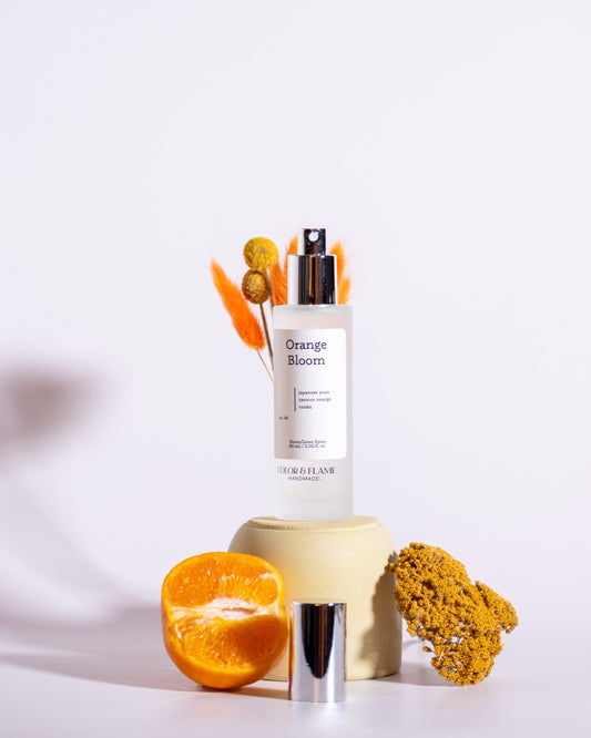Color & Flame Handmade Orange Bloom room and linen spray styled with orange and warm golden dried flowers.
