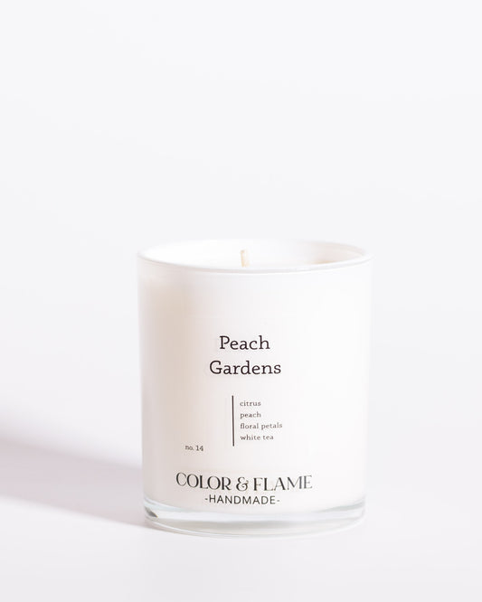 Color & Flame Handmade Peach Gardens Core Collection candle in a white glass jar.
