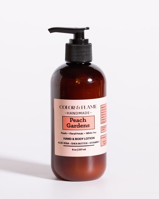 Color & Flame Handmade Peach Gardens hand and body lotion in an amber pump bottle.
