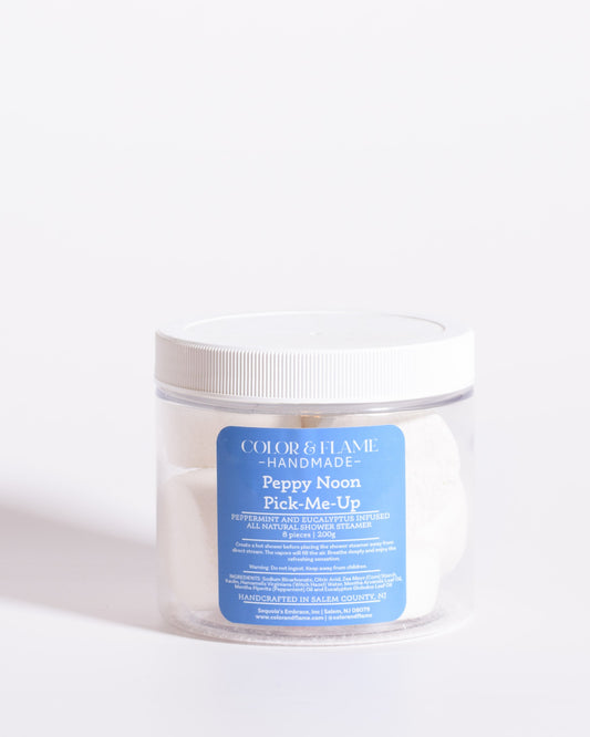 Color & Flame Handmade Peppy Noon Pick-Me-Up peppermint and eucalyptus shower steamers in a clear jar.
