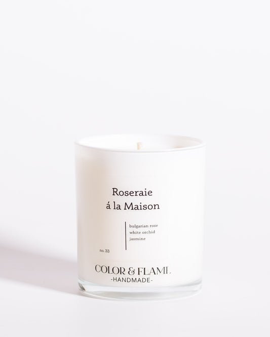 Color & Flame Handmade Roseraie à la Maison Core Collection candle in a white glass jar.
