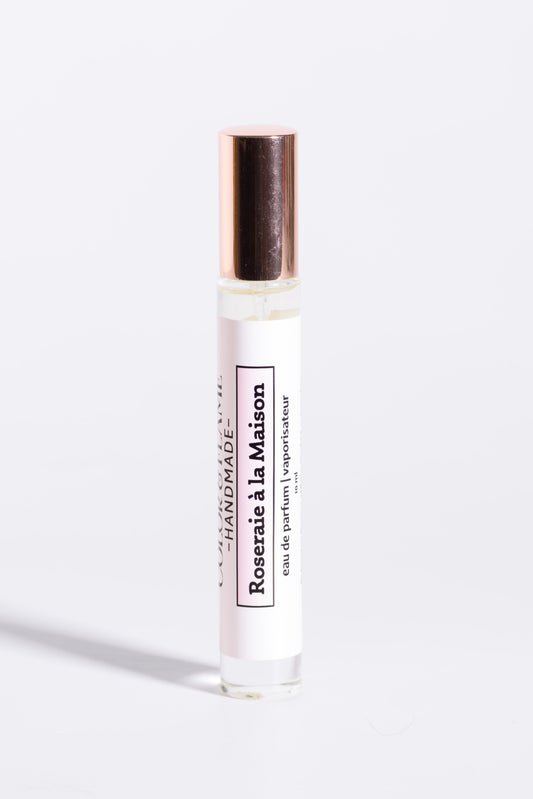 Color & Flame Handmade Roseraie à la Maison 10 ml perfume spray with its rose-gold cap attached.
