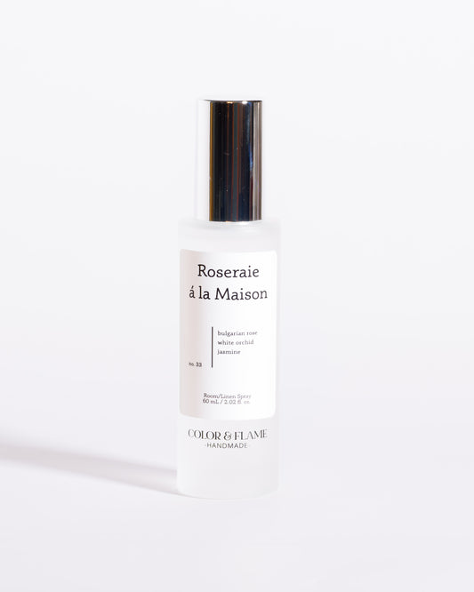 Color & Flame Handmade Roseraie à la Maison room and linen spray bottle with its silver cap attached.
